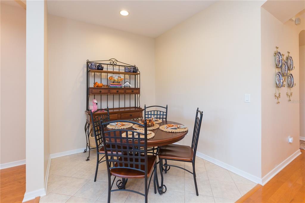 2816 Graphite Court Valrico, FL 33594 - Photo 14 of 57 a view of a dining room that has a table and chair