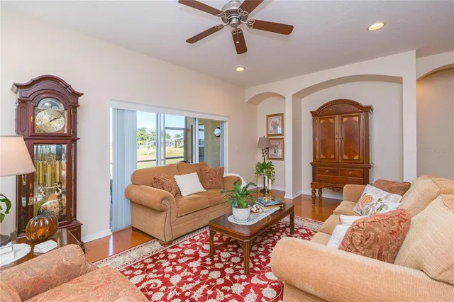 a living room with furniture and a window