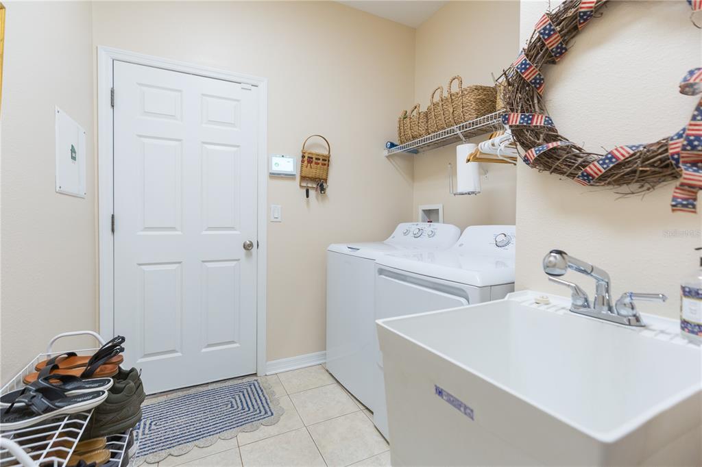 2816 Graphite Court Valrico, FL 33594 - Photo 22 of 57 a utility room with sink dryer and washer