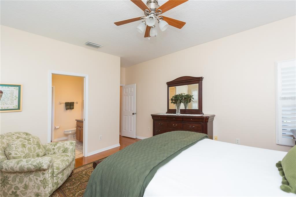 2816 Graphite Court Valrico, FL 33594 - Photo 29 of 57 a bedroom with a bed and a dresser