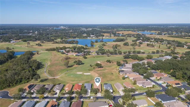 an aerial view of a house with a lake view
