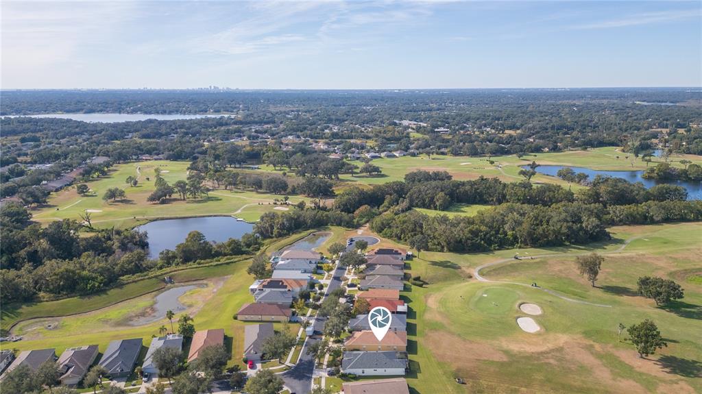2816 Graphite Court Valrico, FL 33594 - Photo 44 of 57 an aerial view of a house with a lake view