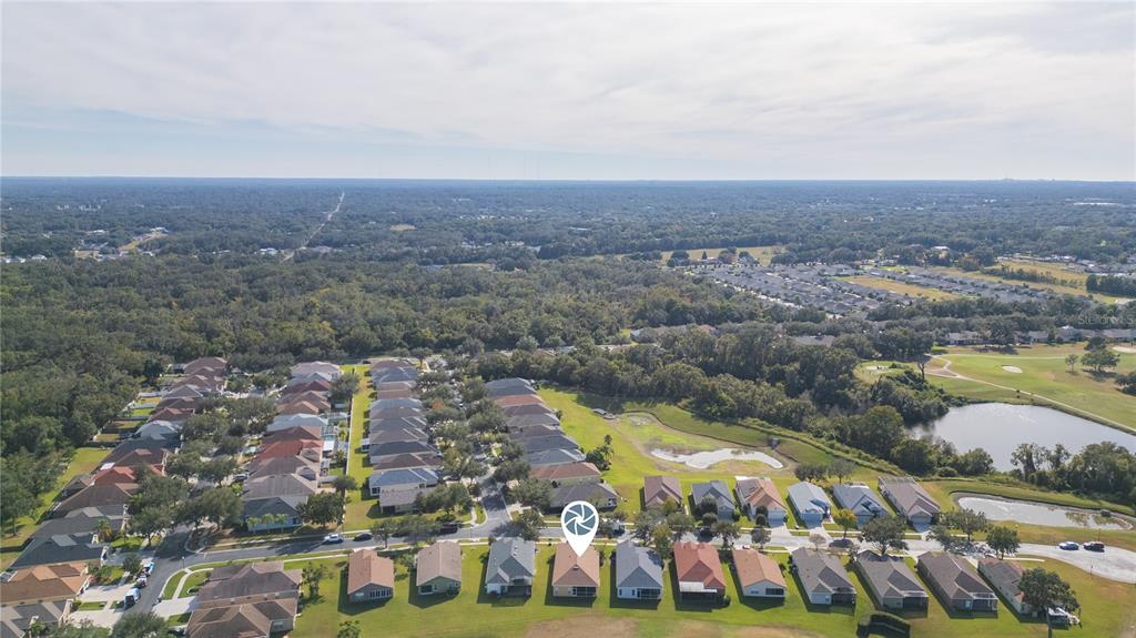 2816 Graphite Court Valrico, FL 33594 - Photo 46 of 57 an aerial view of house with yard swimming pool and ocean view