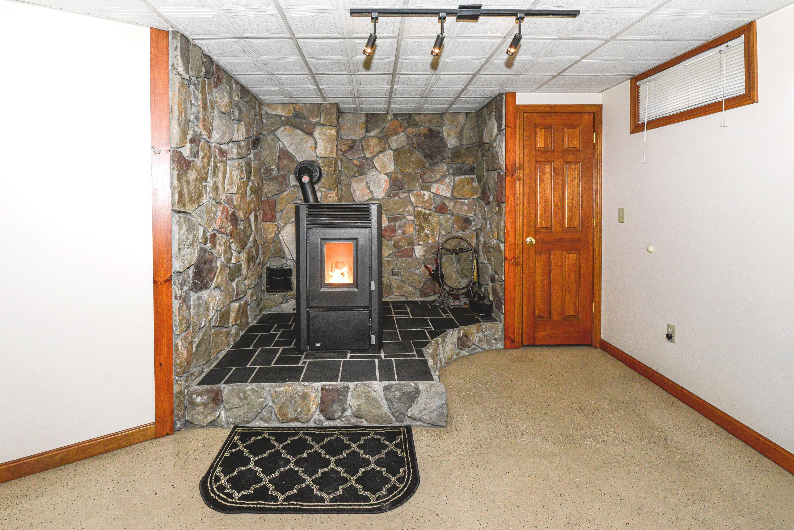 63 George Hannon Road Casco, ME 04015 - Photo 18 of 87 Pellet Stove hearth in Basement