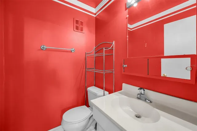 a front view of a house with garden and garage