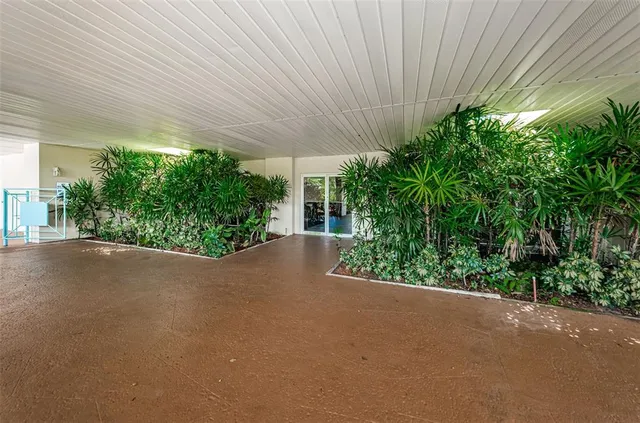 a view of a house with swimming pool and sitting area