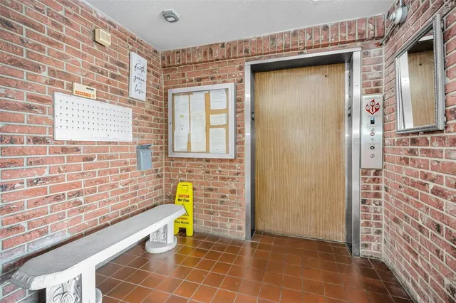 a living room with furniture and potted plant