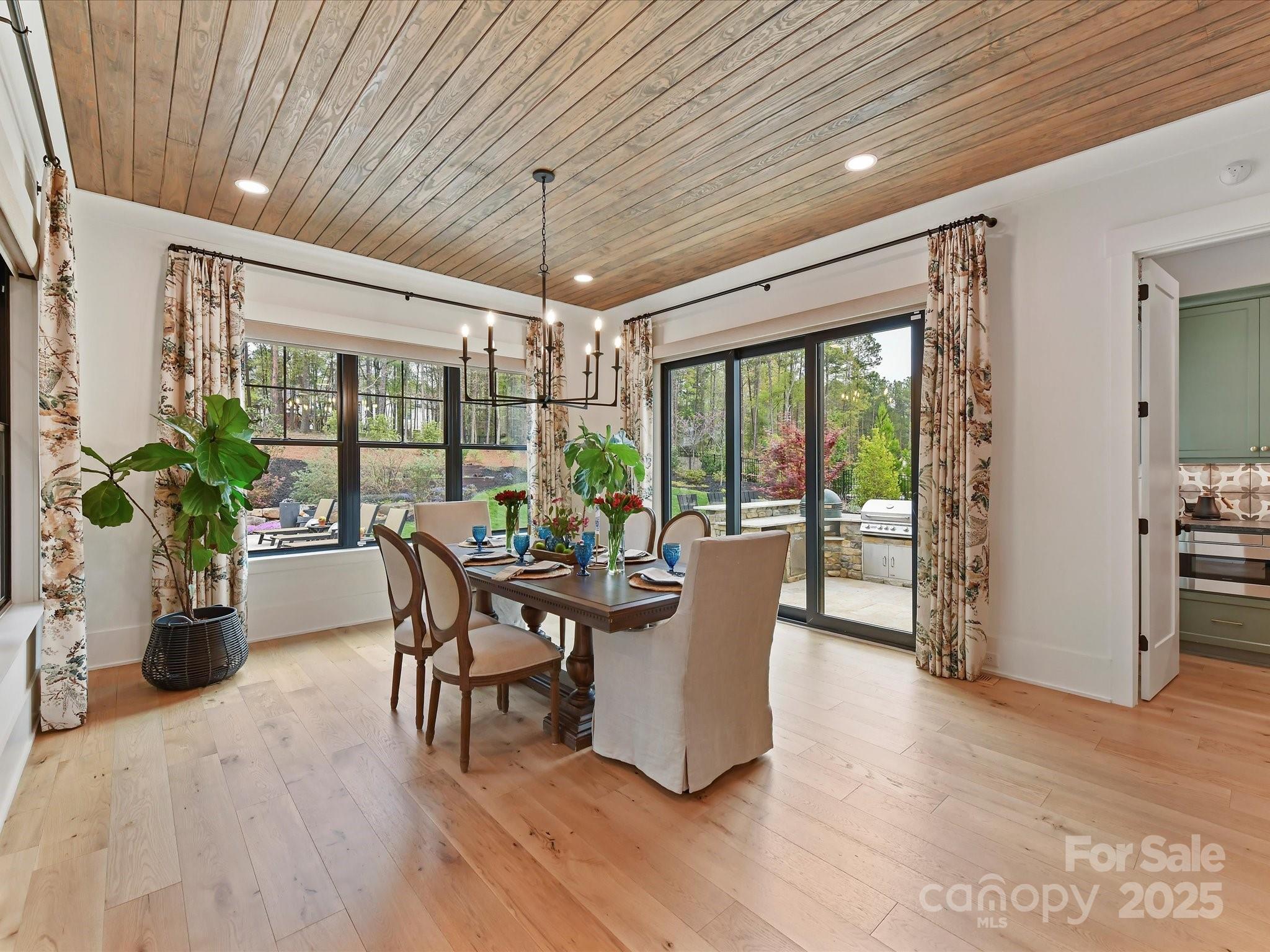 2954 Holbrook Road Fort Mill, SC 29715 - Photo 14 of 47 a dining room with furniture water view and a potted plant