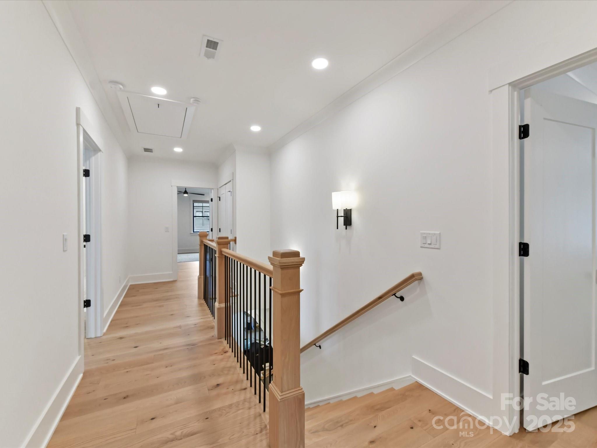 2954 Holbrook Road Fort Mill, SC 29715 - Photo 23 of 47 a view of a hallway with wooden floor and staircase
