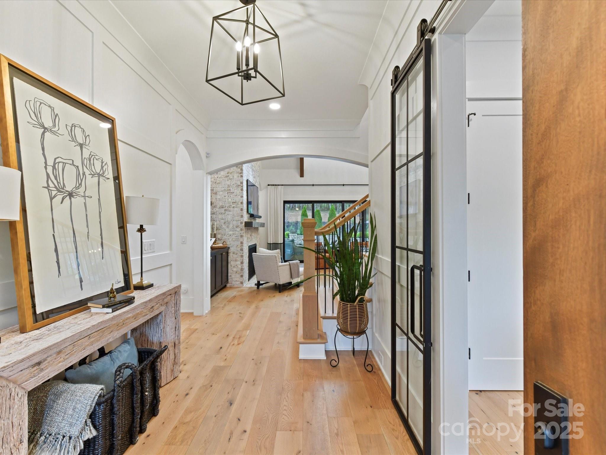 2954 Holbrook Road Fort Mill, SC 29715 - Photo 4 of 47 a view of a hallway with a dining table chairs and couches