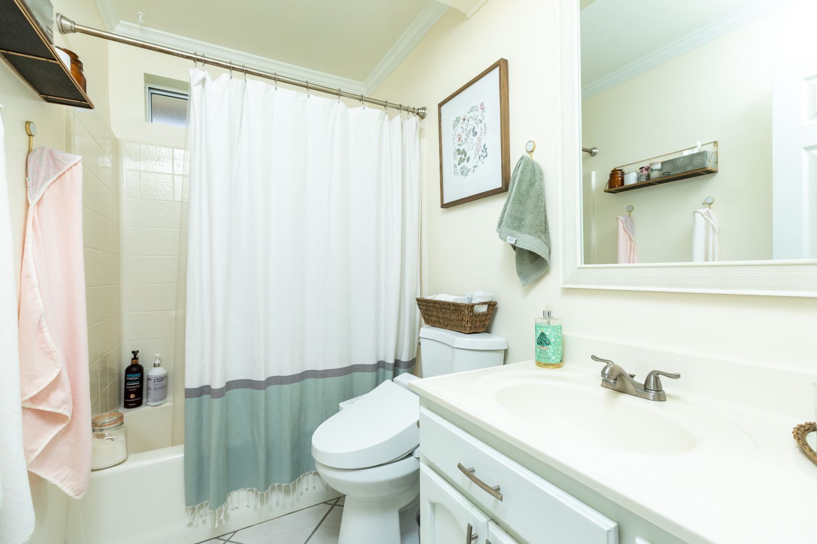 413 North Inyo Street Ridgecrest, CA 93555 - Photo 22 of 27 a bathroom with a sink a toilet and shower curtain