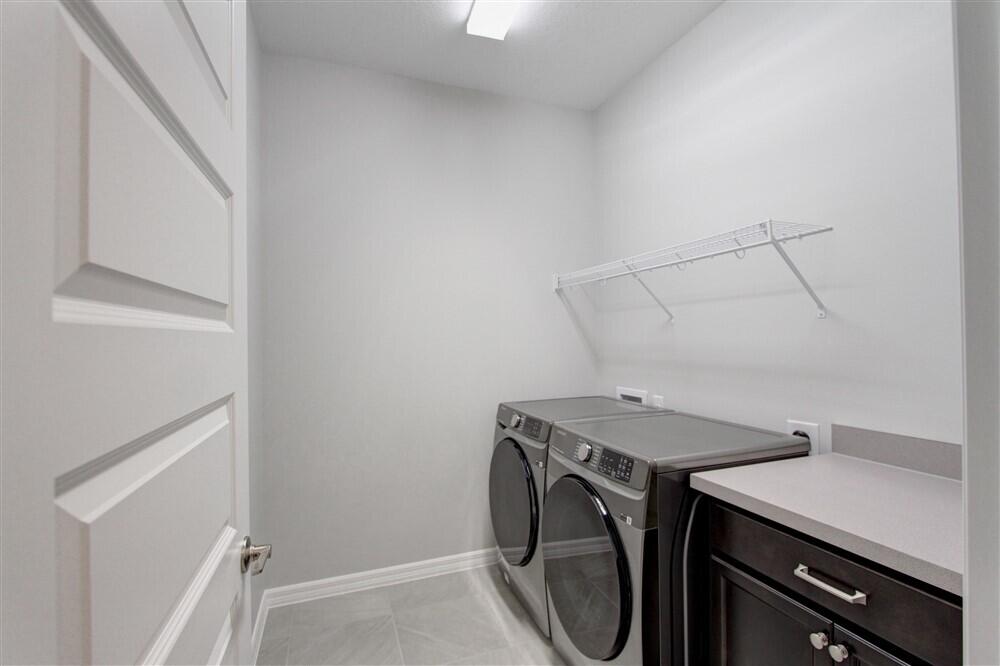 2508 Pangea Circle Melbourne, FL 32940 - Photo 22 of 34 a utility room with dryer and washer