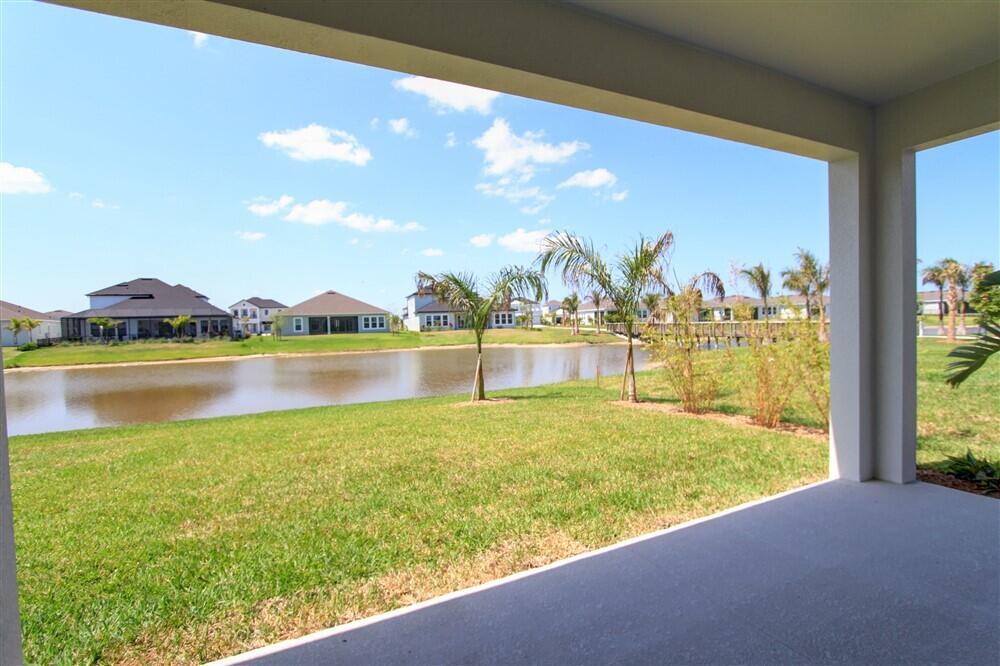 2508 Pangea Circle Melbourne, FL 32940 - Photo 29 of 34 a view of a lake with a big yard