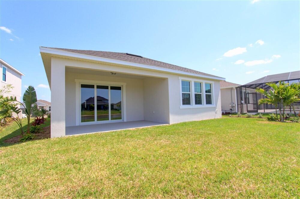2508 Pangea Circle Melbourne, FL 32940 - Photo 30 of 34 a view of a house with backyard and porch