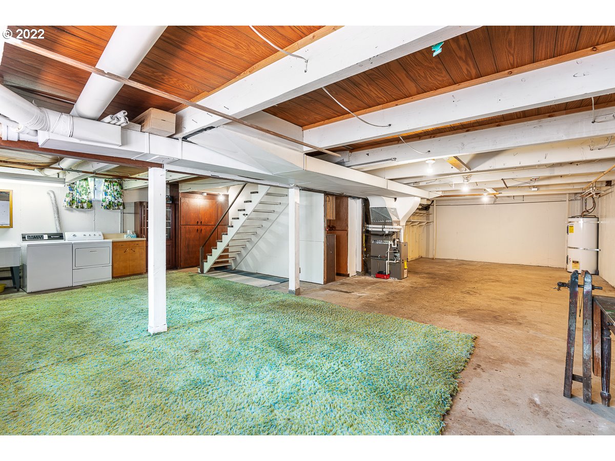 9020 Southwest Terwilliger Boulevard Portland, OR 97219 - Photo 19 of 31 a view of a backyard of a house