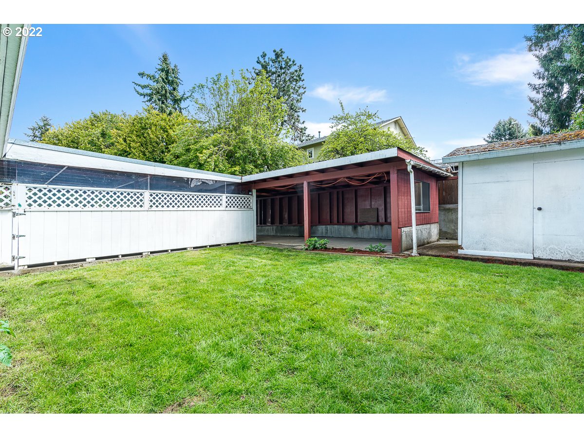 9020 Southwest Terwilliger Boulevard Portland, OR 97219 - Photo 24 of 31 a view of a house with a yard
