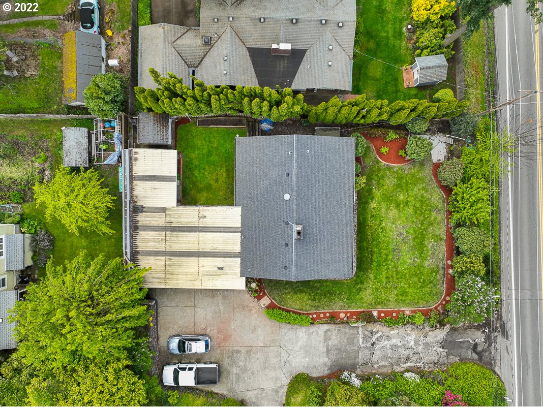 9020 Southwest Terwilliger Boulevard Portland, OR 97219 - Photo 25 of 31 an aerial view of a house with a yard