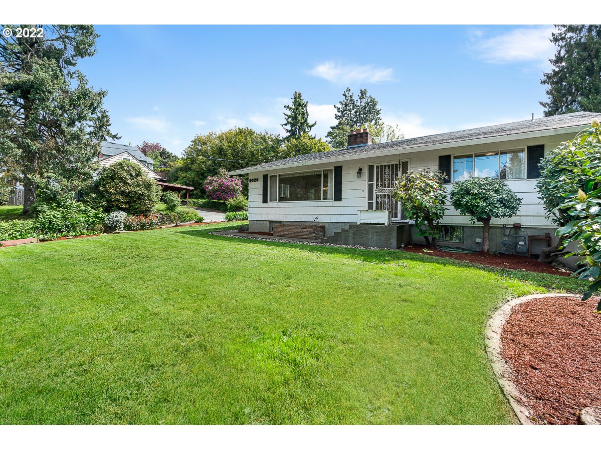 9020 Southwest Terwilliger Boulevard Portland, OR 97219 - Photo 3 of 31 a front view of a house with garden