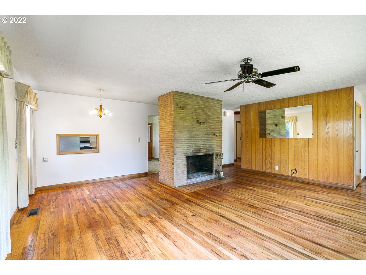 9020 Southwest Terwilliger Boulevard Portland, OR 97219 - Photo 6 of 31 a view of empty room with a fireplace