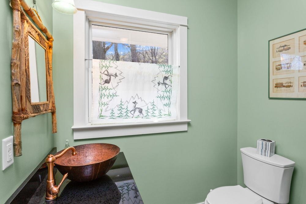 9586 Brunk Spring Lane Broadway, VA 22815 - Photo 18 of 58 a bathroom with a toilet and a sink
