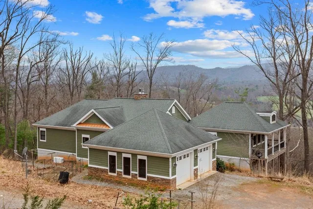 a aerial view of a house with a yard