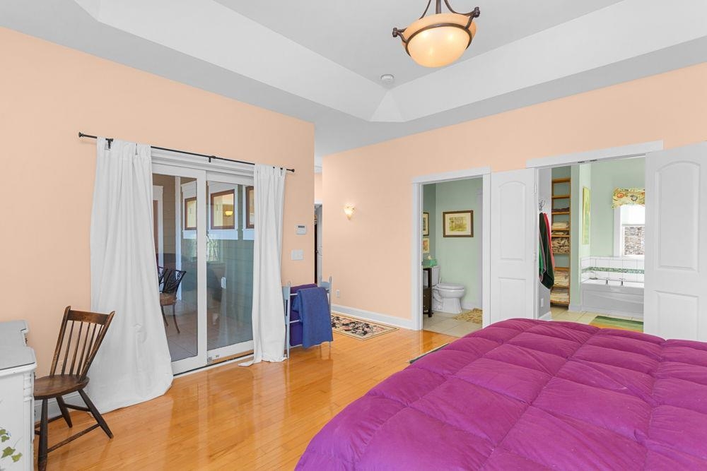 9586 Brunk Spring Lane Broadway, VA 22815 - Photo 21 of 58 a bedroom with a bed and chair