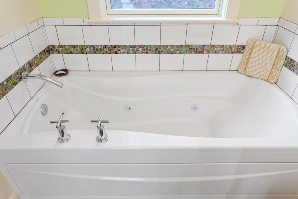 9586 Brunk Spring Lane Broadway, VA 22815 - Photo 28 of 58 a bathroom with a bathtub