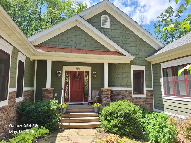 a front view of a house with a yard