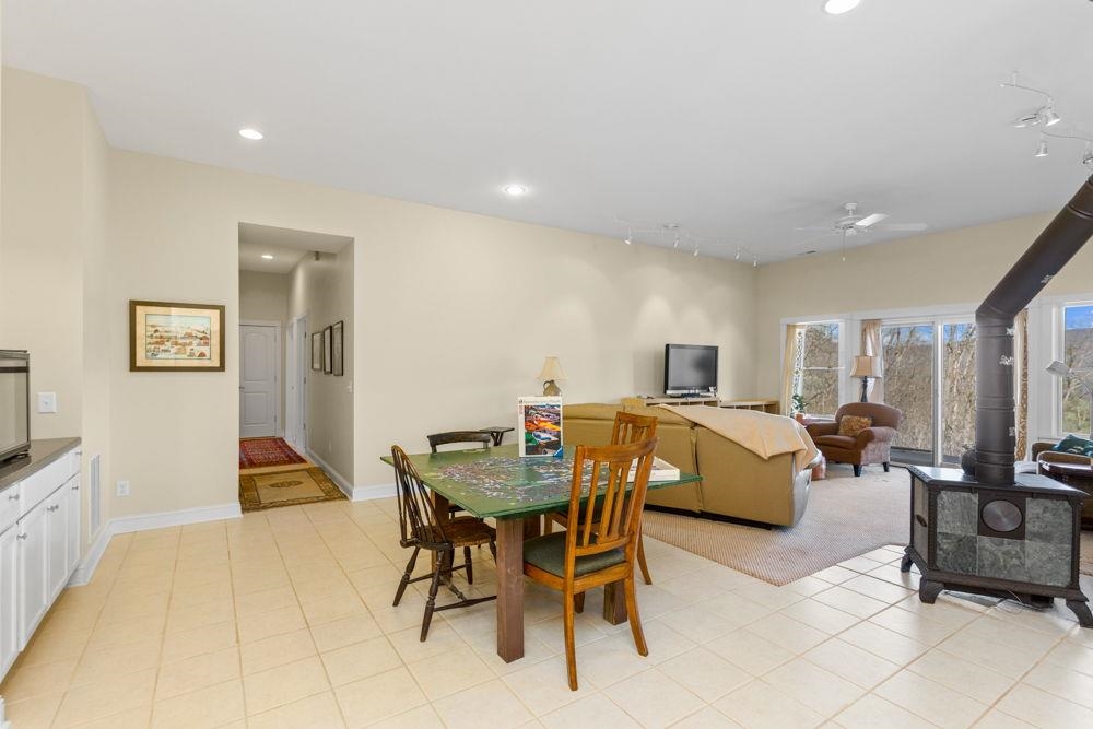 9586 Brunk Spring Lane Broadway, VA 22815 - Photo 34 of 58 a living room with furniture and a flat screen tv