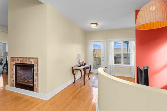 a view of a livingroom with furniture and a fireplace