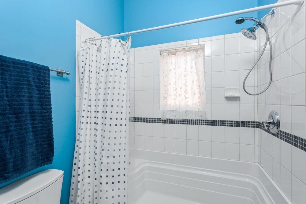 9586 Brunk Spring Lane Broadway, VA 22815 - Photo 40 of 58 a bathroom with a shower and a bathtub