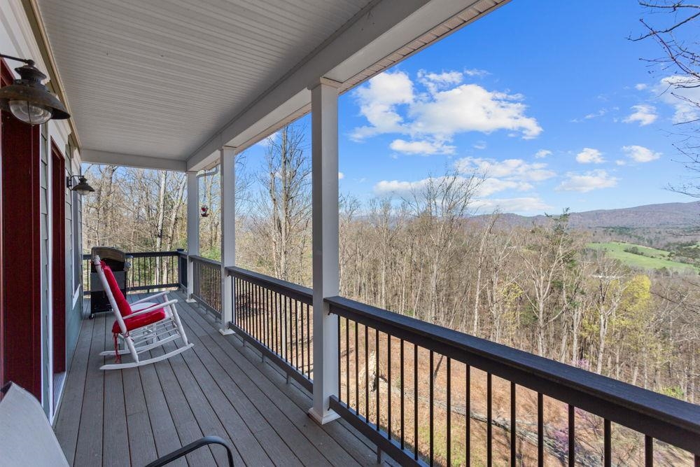 9586 Brunk Spring Lane Broadway, VA 22815 - Photo 42 of 58 a view of roof deck with wooden floor and fence