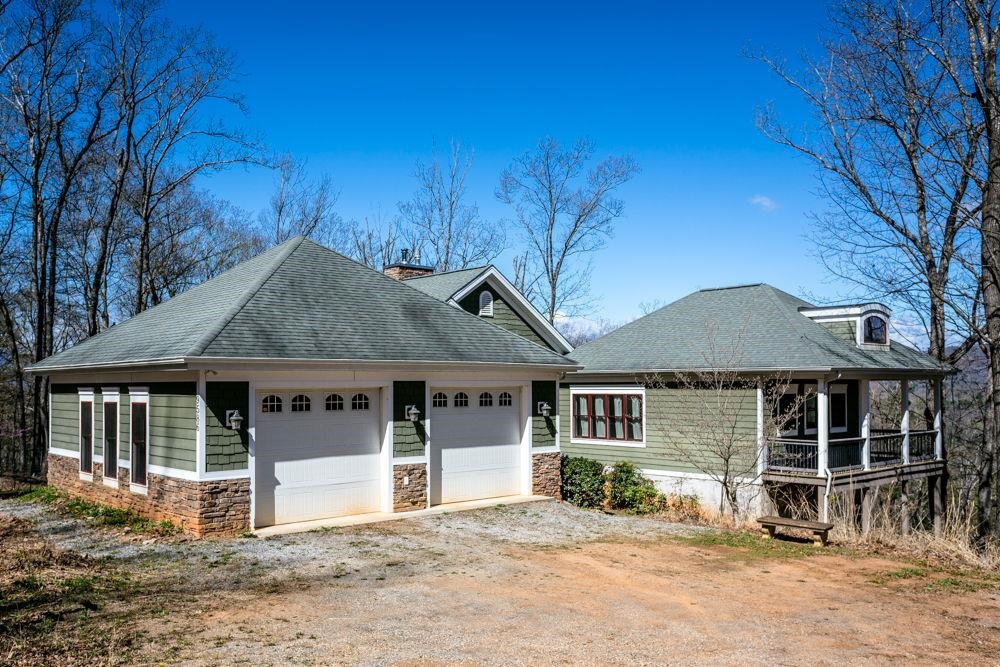 9586 Brunk Spring Lane Broadway, VA 22815 - Photo 53 of 58 a front view of a house with a garden and yard