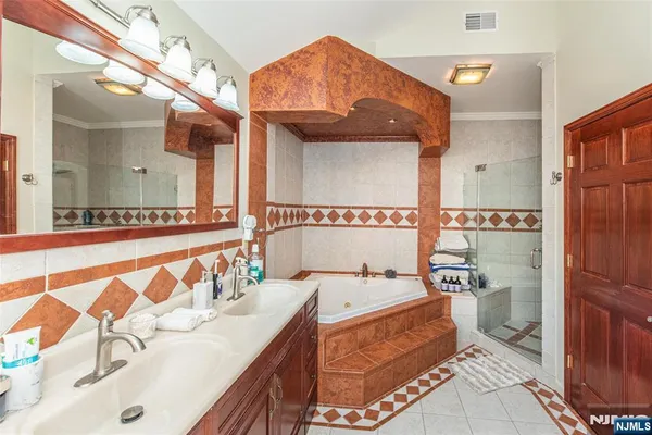 a bathroom with a sink a mirror and a toilet