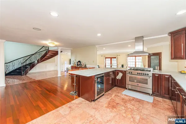 a kitchen with stainless steel appliances granite countertop a stove and a sink