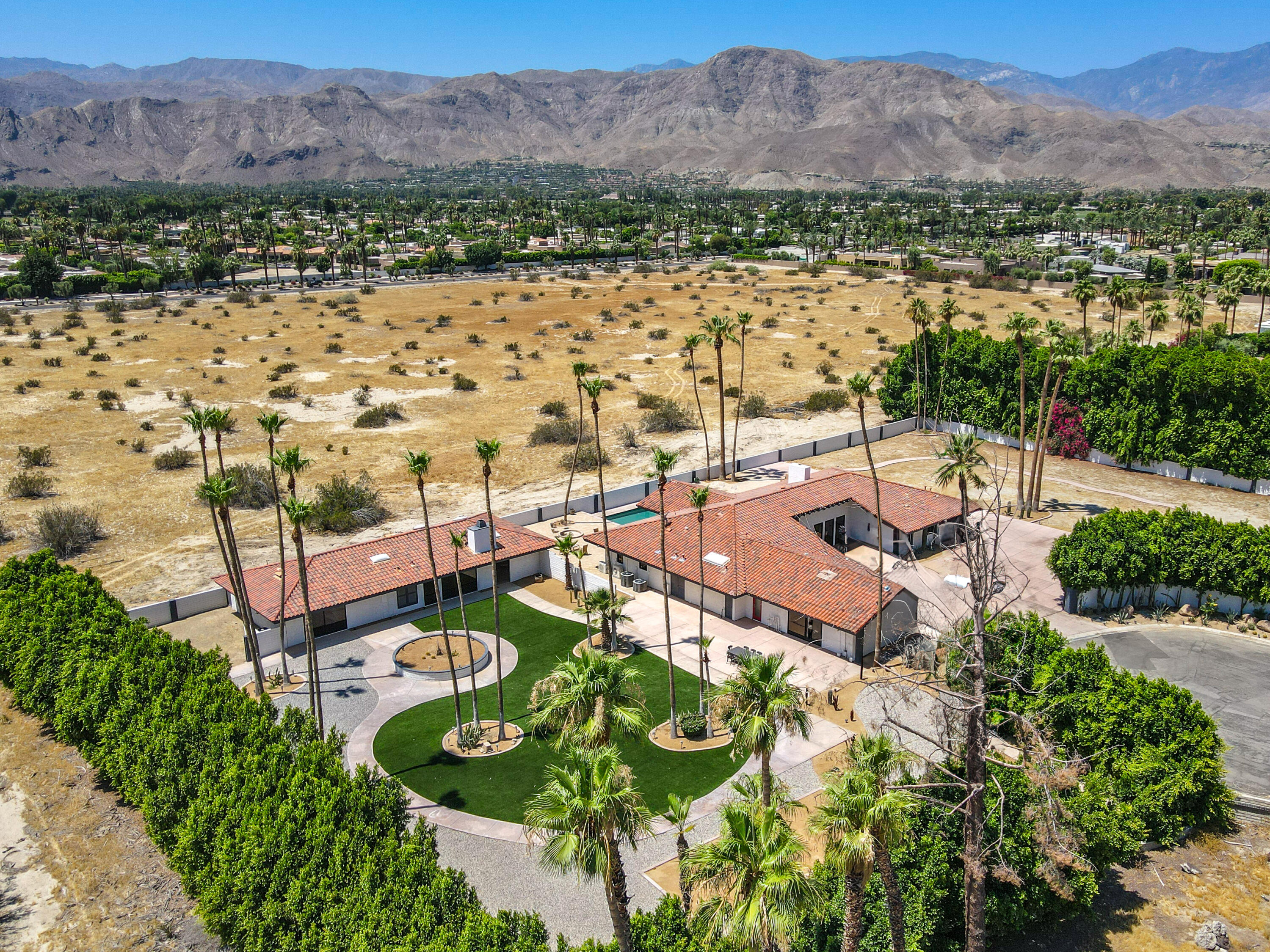401 Iris Lane Rancho Mirage, CA 92270 - Photo 1 of 87 a view of a city with a mountain