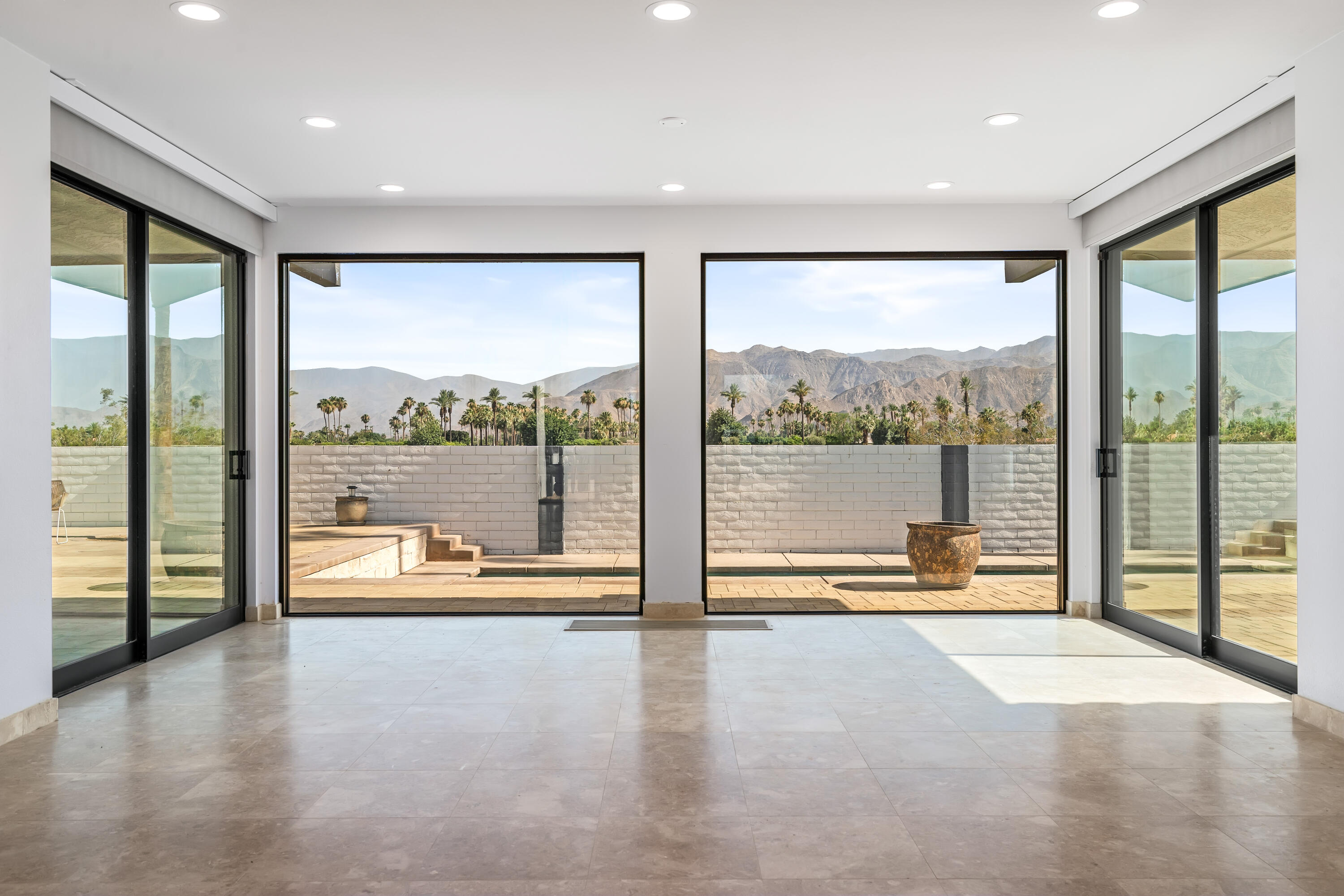 401 Iris Lane Rancho Mirage, CA 92270 - Photo 12 of 87 a view of an empty room with a large window