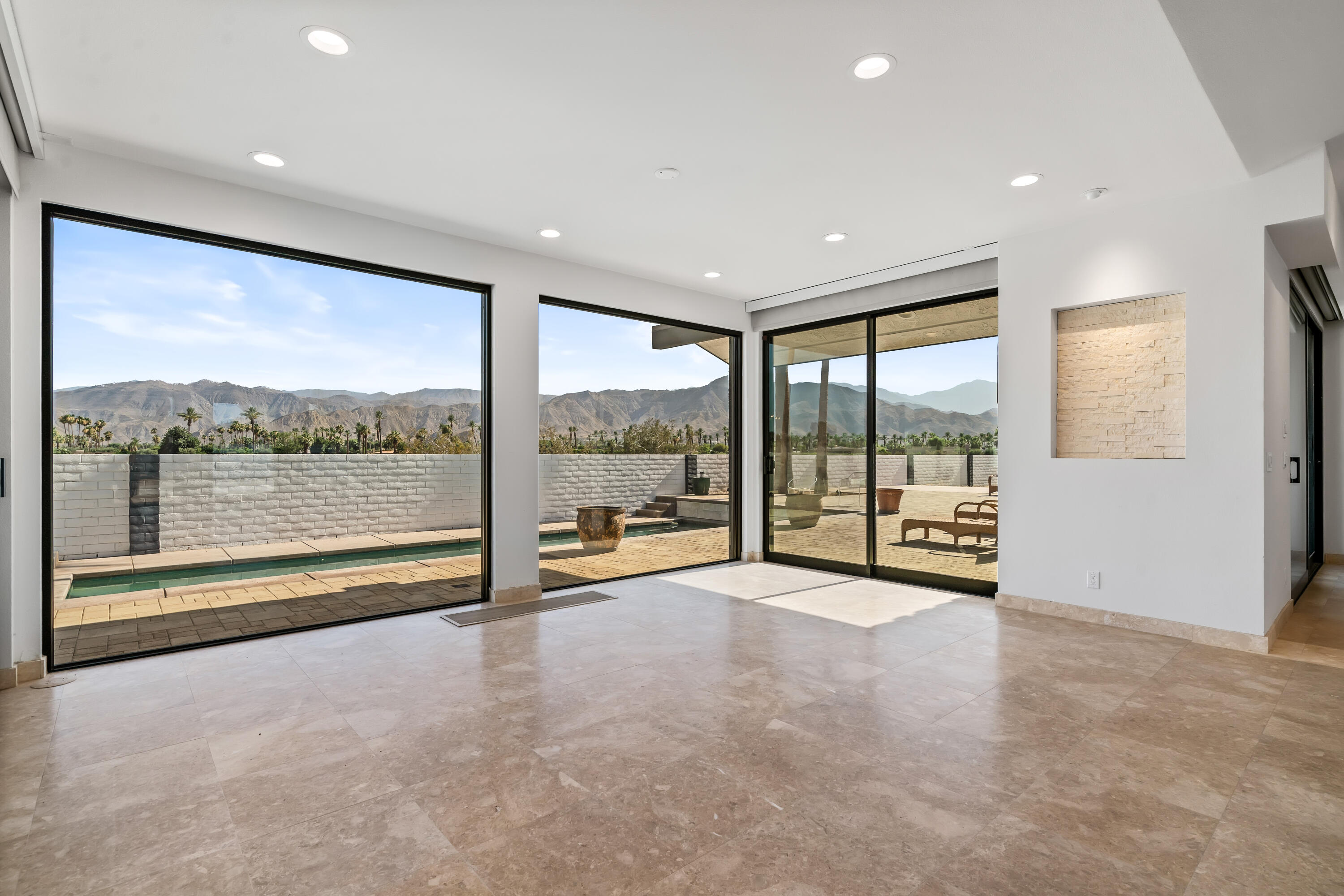 401 Iris Lane Rancho Mirage, CA 92270 - Photo 14 of 87 a view of an empty room with a large window