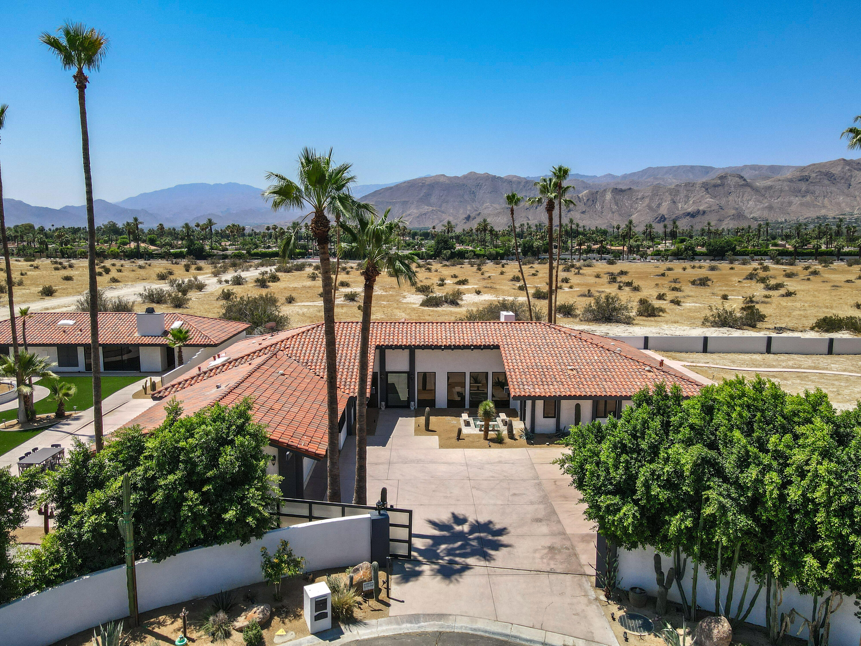 401 Iris Lane Rancho Mirage, CA 92270 - Photo 2 of 87 a view of a city with a building in the background