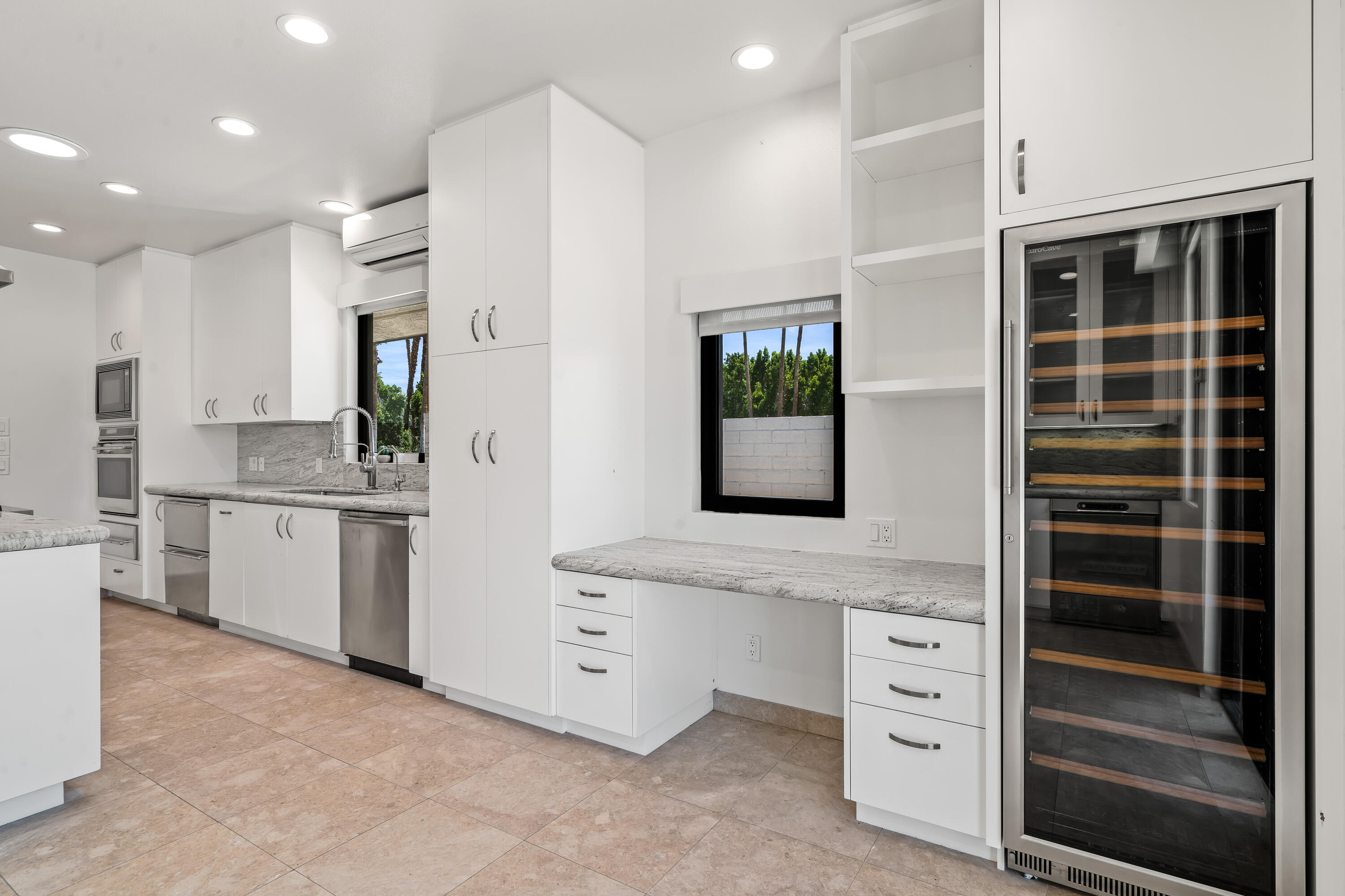 401 Iris Lane Rancho Mirage, CA 92270 - Photo 24 of 87 a kitchen with stainless steel appliances a refrigerator and window