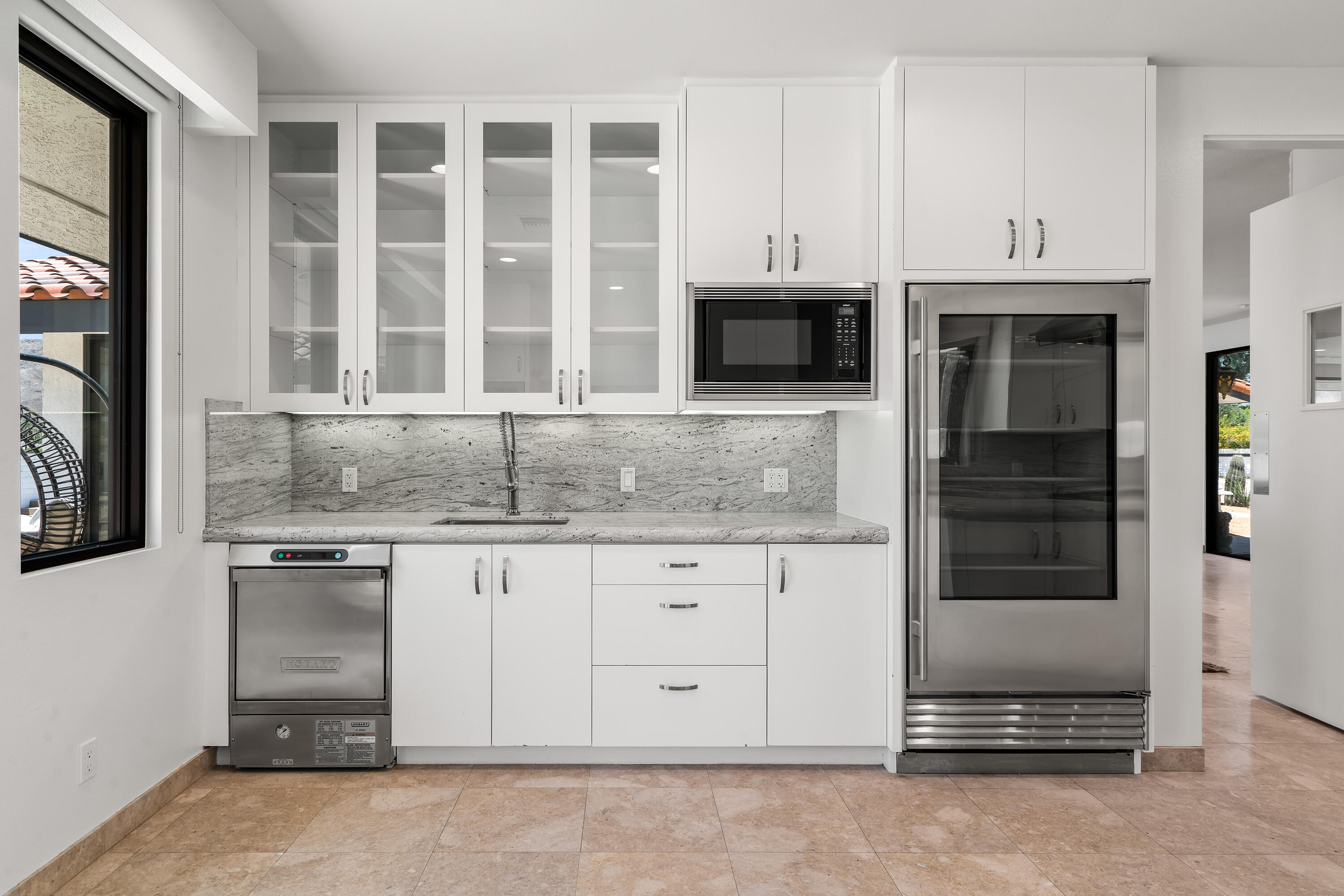 401 Iris Lane Rancho Mirage, CA 92270 - Photo 25 of 87 a kitchen with granite countertop white cabinets and oven