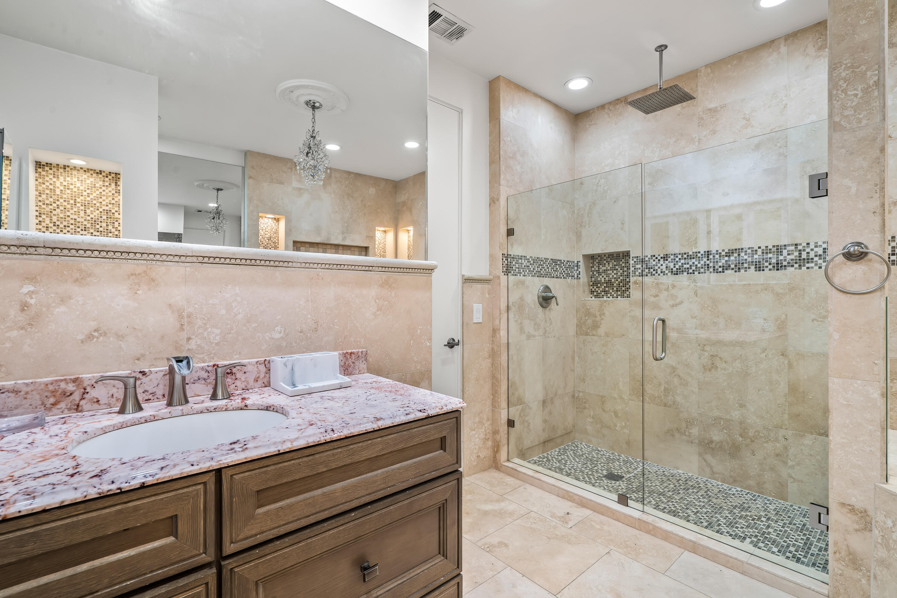 401 Iris Lane Rancho Mirage, CA 92270 - Photo 38 of 87 a bathroom with a granite countertop sink a shower and mirror