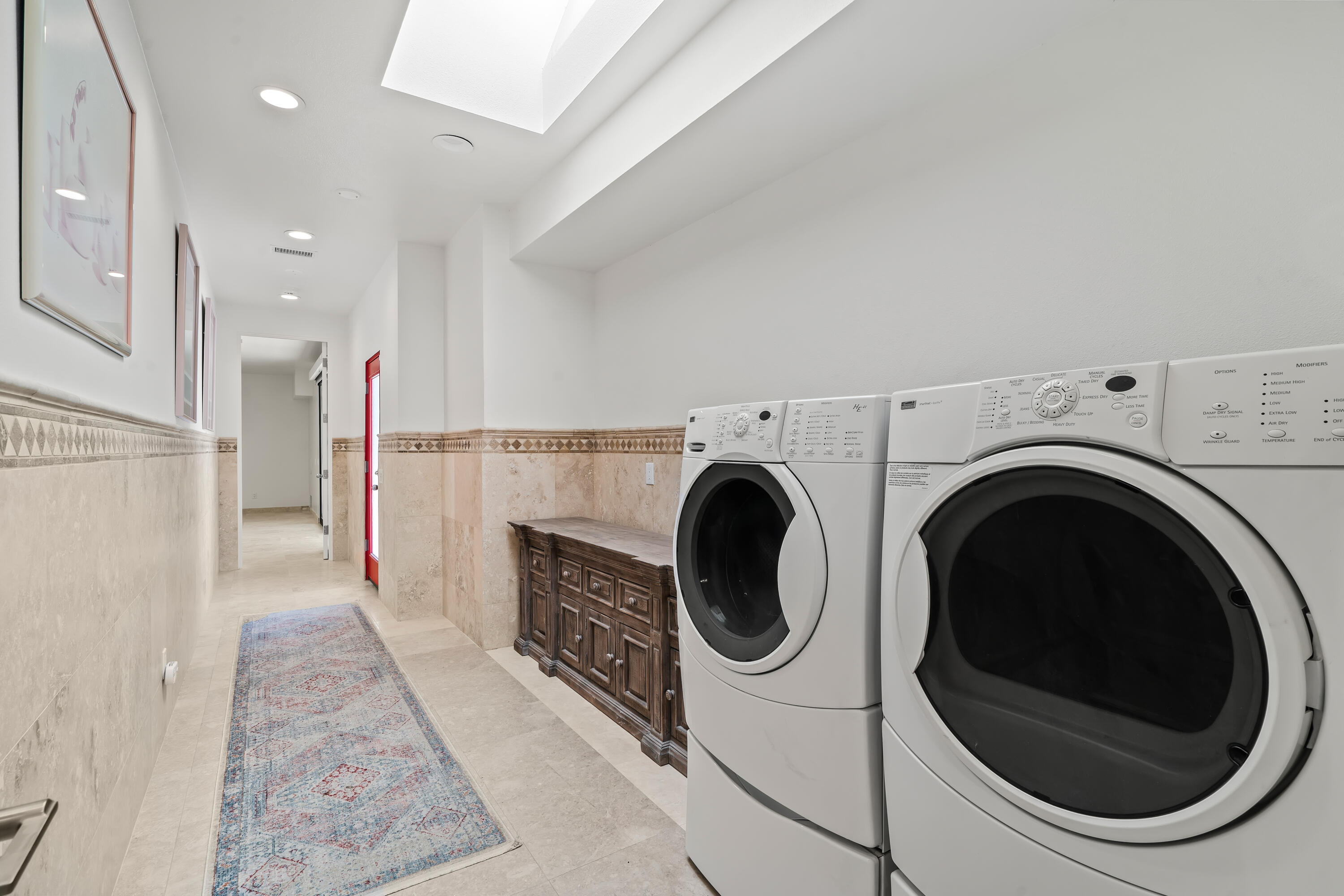401 Iris Lane Rancho Mirage, CA 92270 - Photo 49 of 87 a view of a hallway with washer and dryer