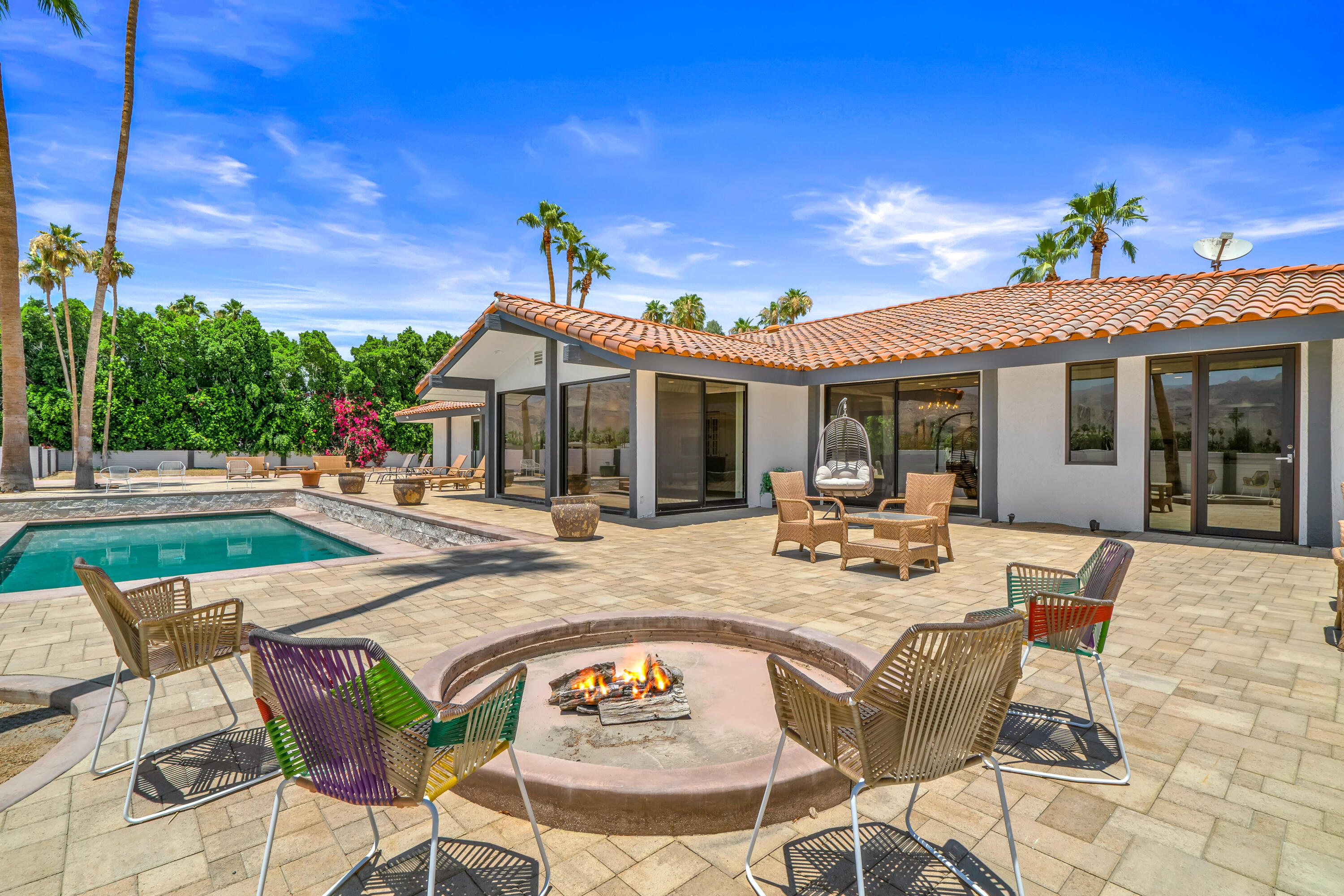 401 Iris Lane Rancho Mirage, CA 92270 - Photo 58 of 87 a view of a house with swimming pool and sitting area
