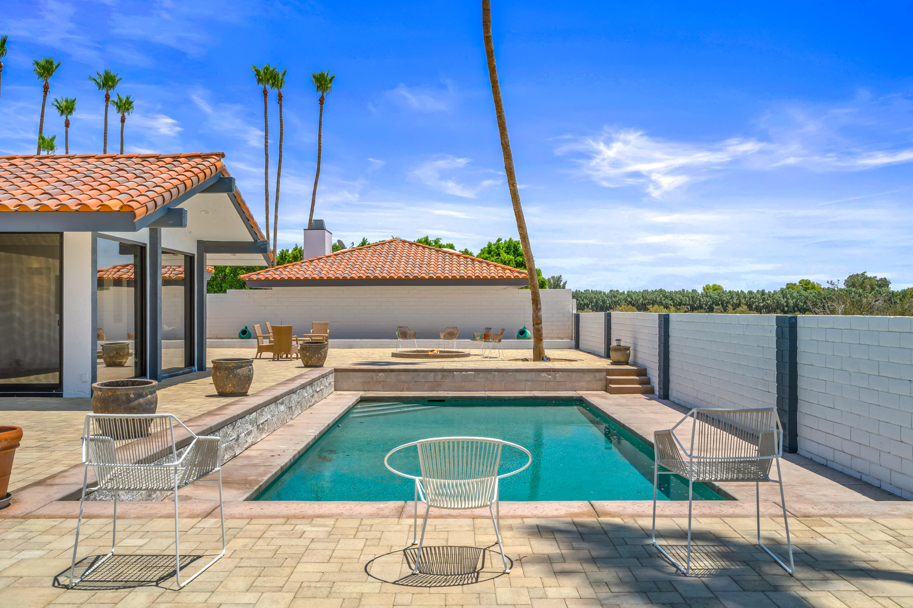 401 Iris Lane Rancho Mirage, CA 92270 - Photo 62 of 87 a view of a chairs and table on the terrace