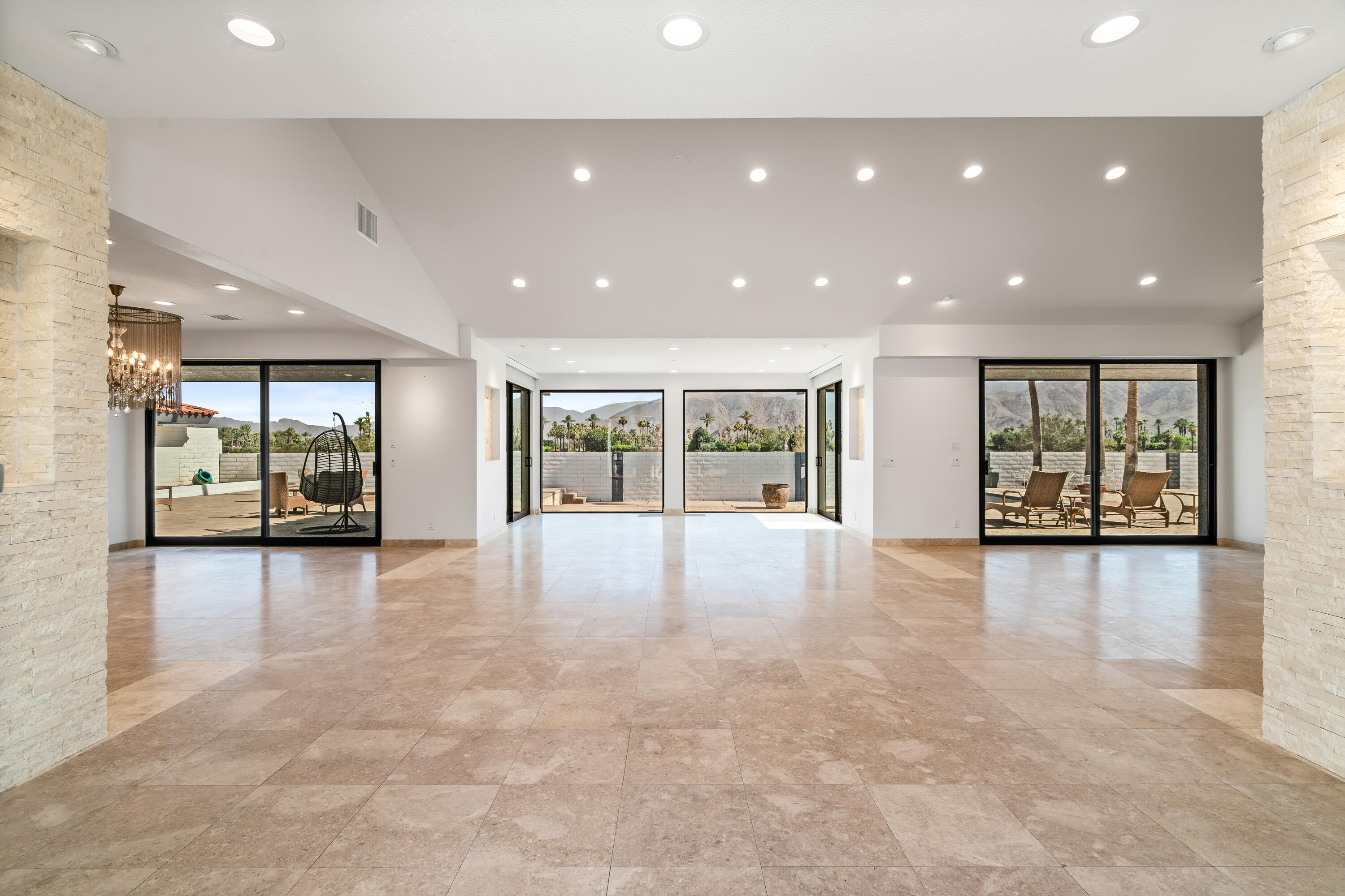 401 Iris Lane Rancho Mirage, CA 92270 - Photo 10 of 87 a view of an empty room with a window and wooden floor