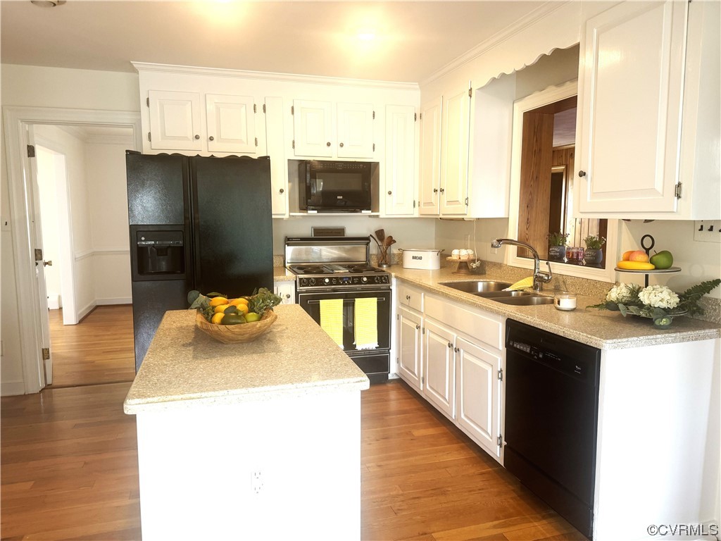 10901 Weybridge Road Chester, VA 23831 - Photo 26 of 32 a kitchen with a sink a stove and refrigerator