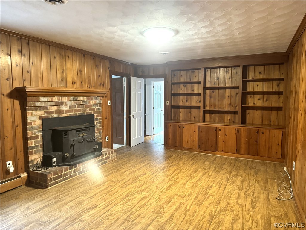 10901 Weybridge Road Chester, VA 23831 - Photo 4 of 32 a view of an empty room with a fireplace and a window