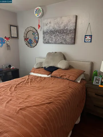 a bedroom with a bed and a table in it