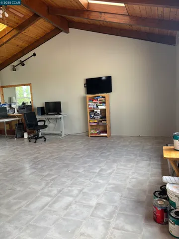 a view of wooden floor and windows in a room